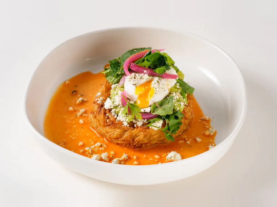 Avo Feta on a crispy Route nest with poached egg, pickled onion and mint feta at Cafe Route