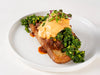 Beef Birria Benedict on sourdough toast with slow-cooked beef, paprika hollandaise and salsa at Cafe Route