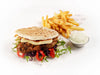Honey harissa chicken pita with halloumi, pickled cabbage, mint yoghurt and skin on chips at Cafe Route