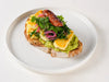 Medi Stack on sourdough with oregano halloumi, scrambled egg, sucuk and avocado at Cafe Route