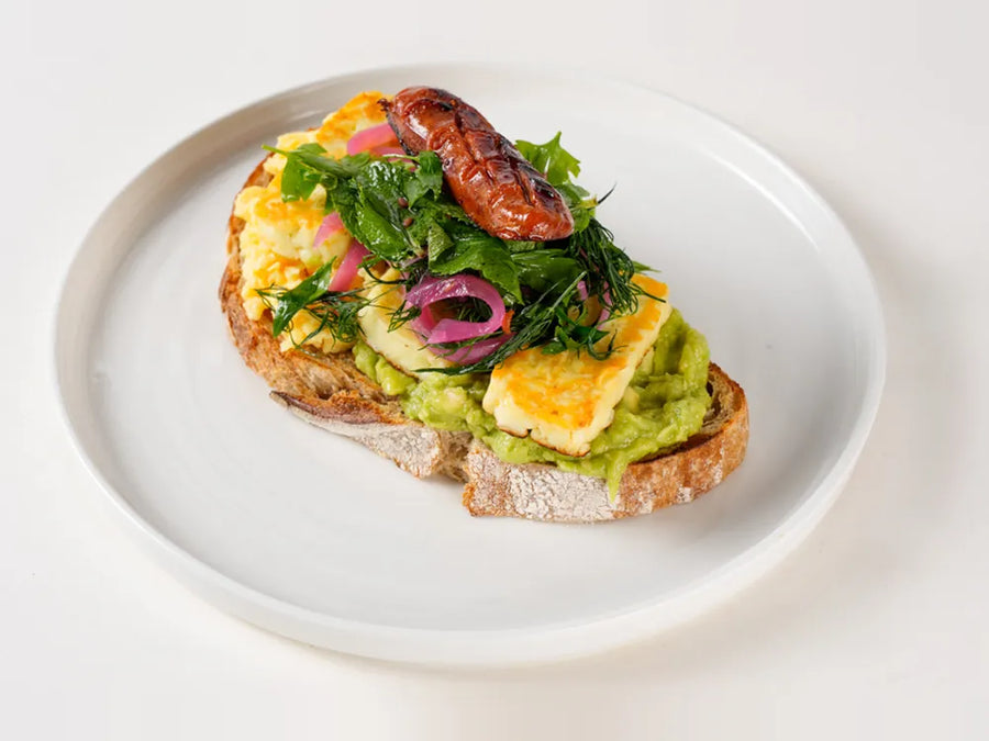 Medi Stack on sourdough with oregano halloumi, scrambled egg, sucuk and avocado at Cafe Route
