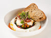 Mediterranean cilbir with poached eggs on garlic yoghurt, spinach, chickpeas and chilli butter