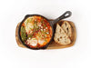 Shakshuka skillet with eggs, labneh, feta and padron pepper served with sourdough at Cafe Route