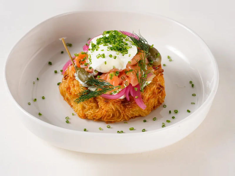Smoked salmon on a Route nest with poached egg, herbed cream cheese, dill and pickled onion