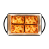 Veggie lasagna portions in a cream serving dish, En Route lunch box main
