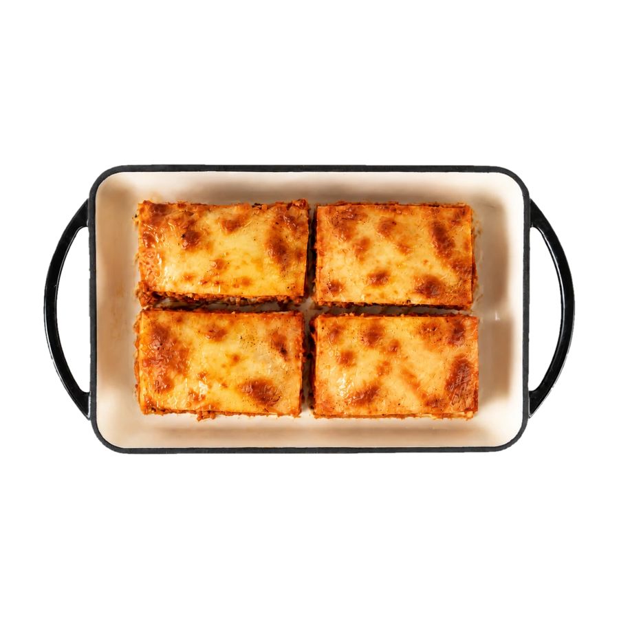 Veggie lasagna portions in a cream serving dish, En Route lunch box main