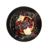 Waffles with berries on a black plate